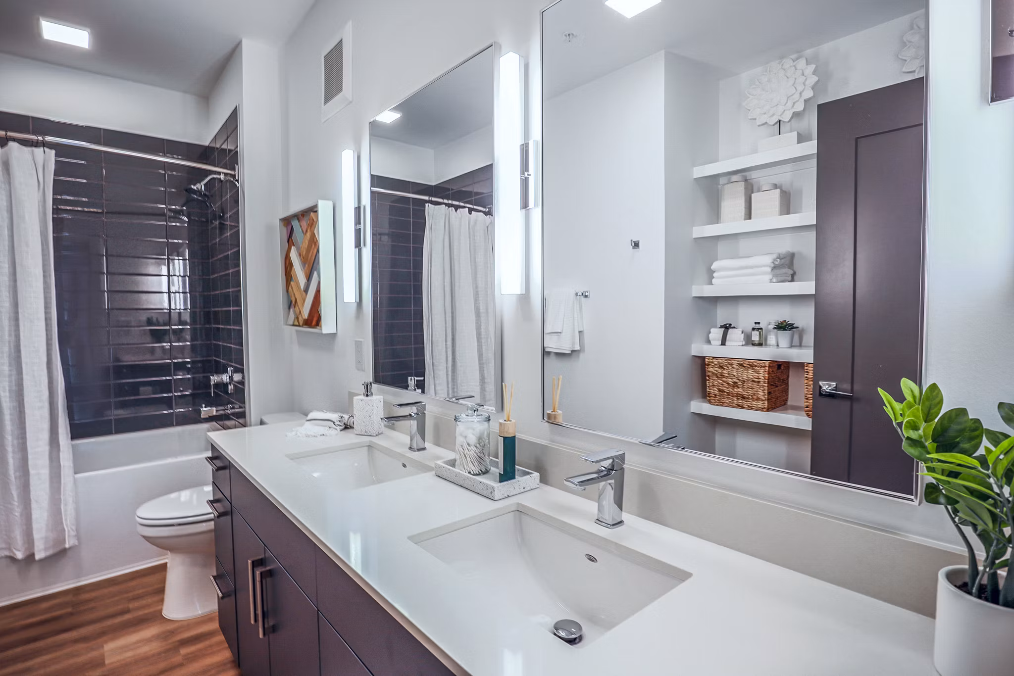 Bathroom featuring modern fixtures and elegant marble accents at Novel Midtown Apartments