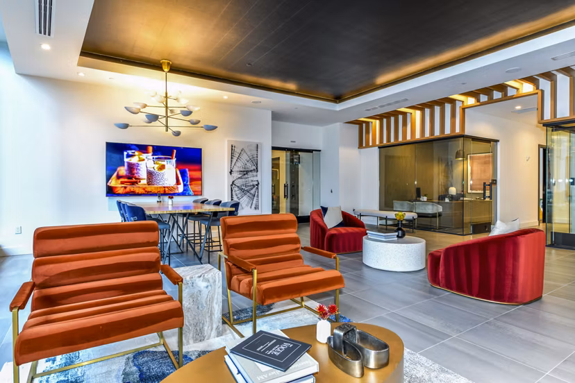 Modern clubhouse with stylish seating and large windows at Novel Midtown Apartments