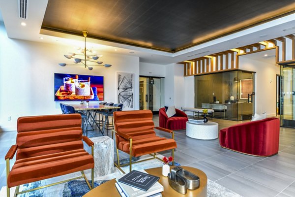 Modern clubhouse with stylish seating and large windows at Novel Midtown Apartments