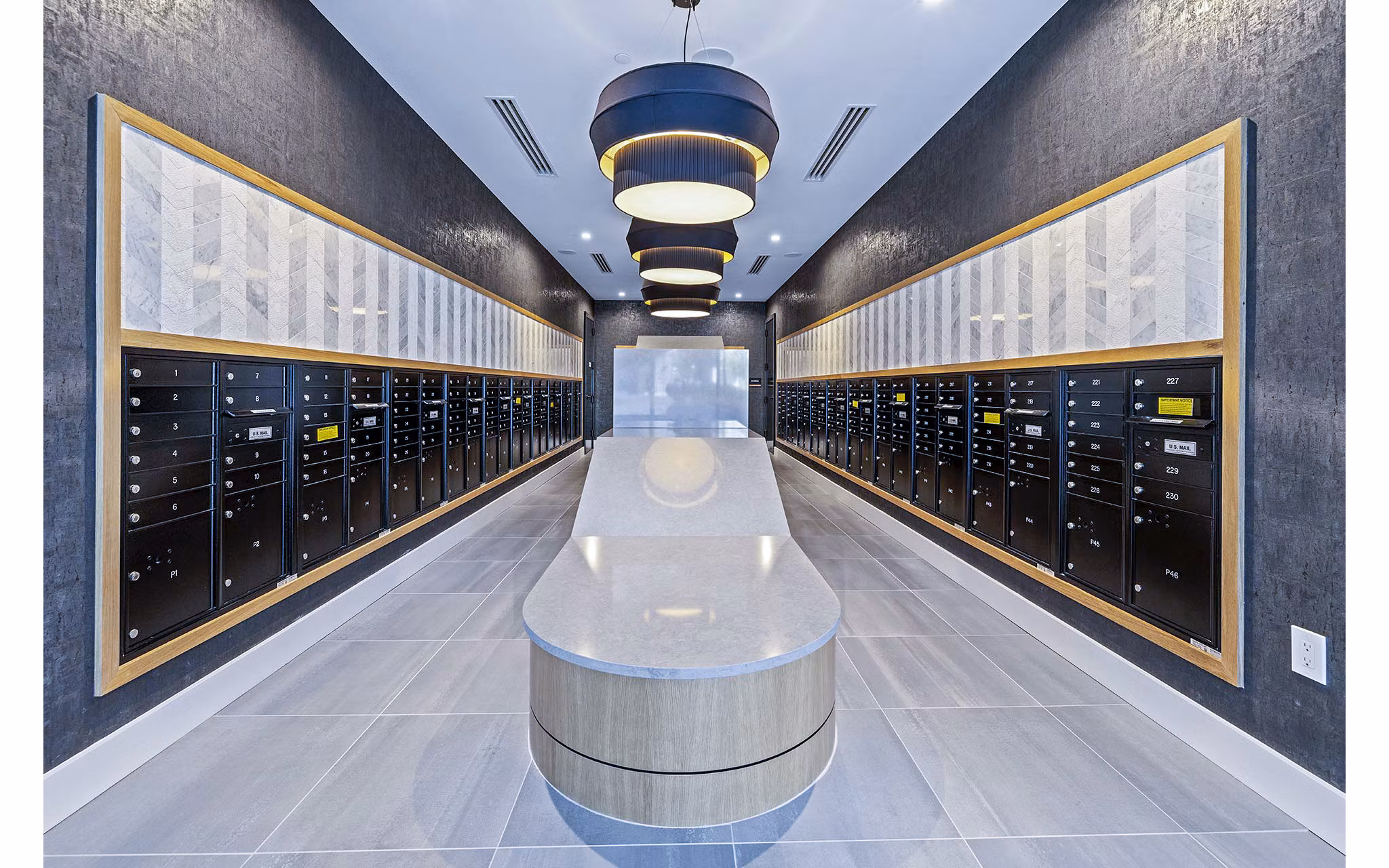 Clubhouse mail room featuring modern design at Novel Midtown Apartments