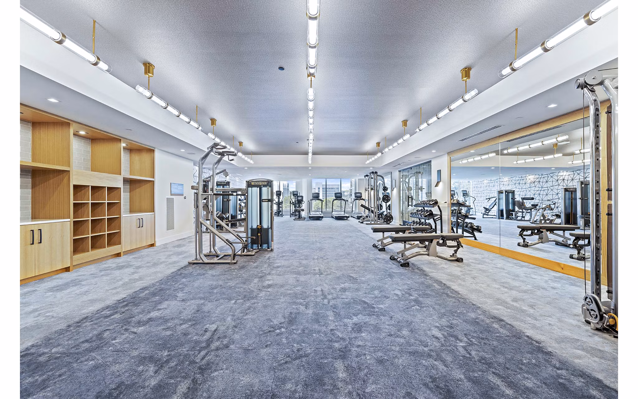 State-of-the-art fitness center at Novel Midtown Apartments with modern equipment and spacious workout area
