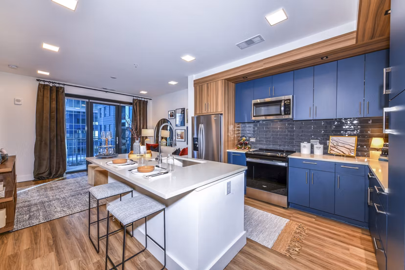 Modern kitchen featuring stainless steel appliances in Novel Midtown Apartments