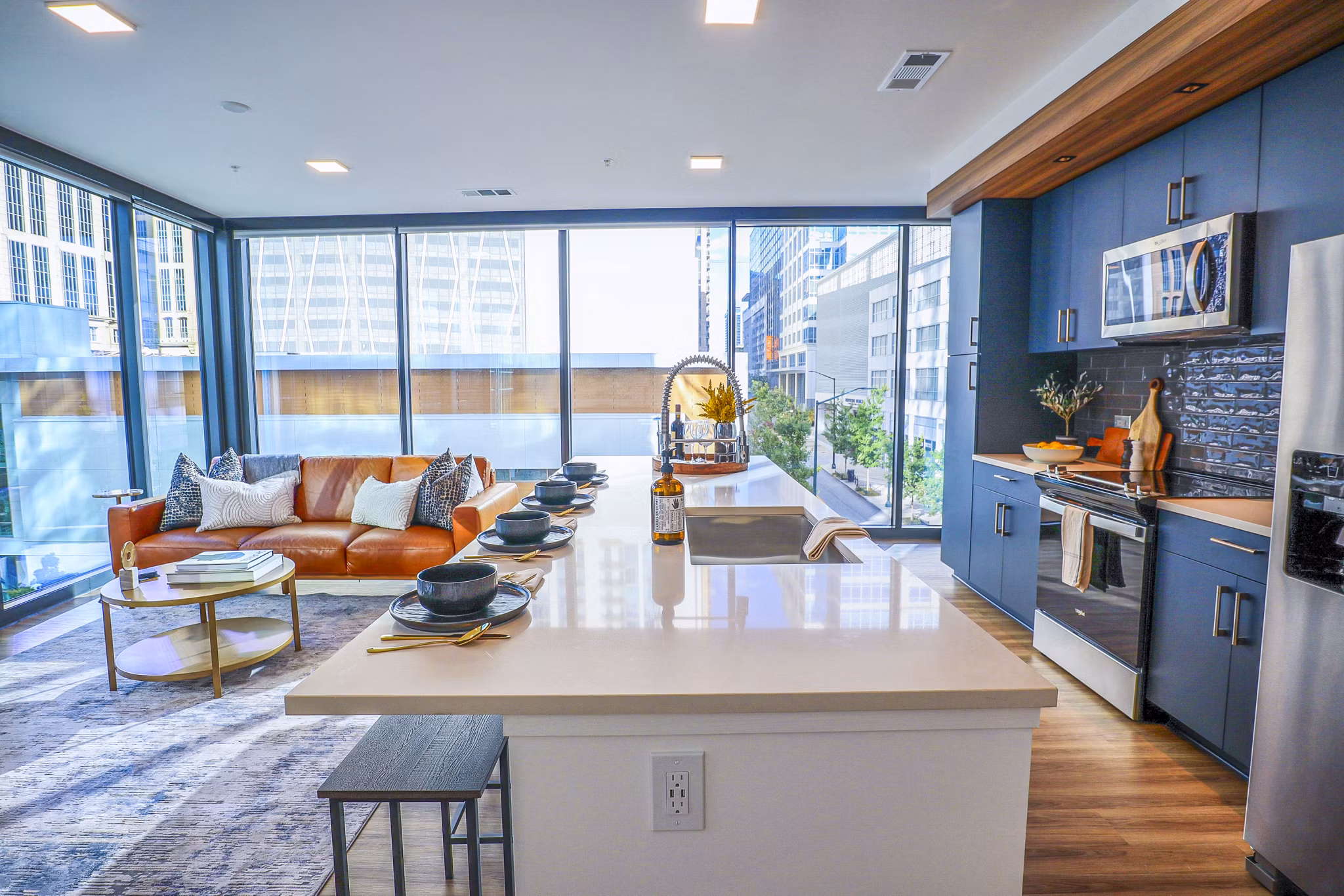 Modern kitchen featuring stainless steel appliances in Novel Midtown Apartments