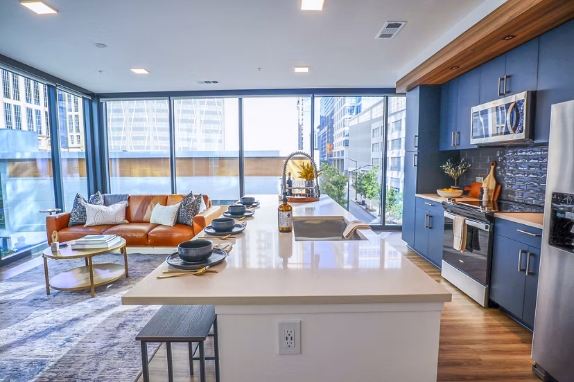 Modern kitchen featuring stainless steel appliances in Novel Midtown Apartments