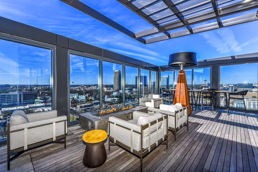 Cozy fire pit on a modern patio at Novel Midtown Apartments, a luxury living experience