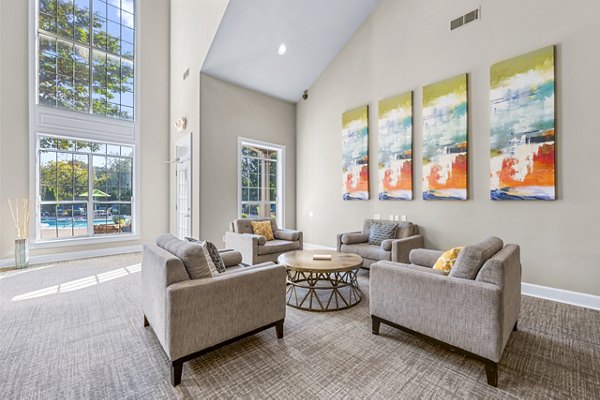 Bridgewater Apartments: Modern clubhouse with cozy seating and gaming areas