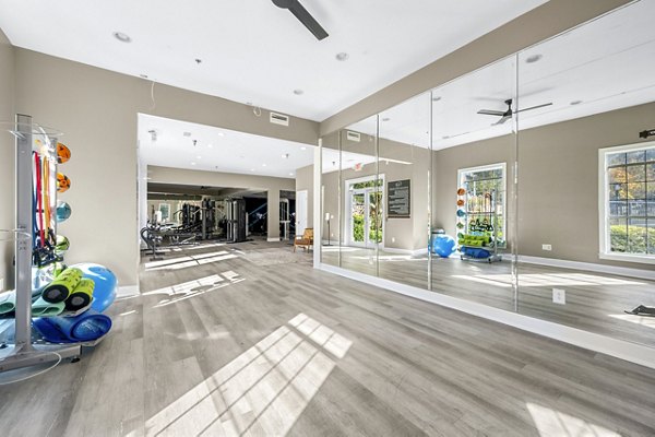 Yoga studio with natural lighting and serene decor at Bridgewater Apartments