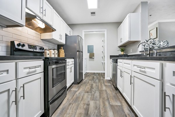 Modern kitchen with stainless steel appliances at Bridgewater Apartments