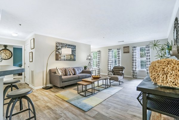 Modern living room with stylish furnishings at Bridgewater Apartments, featuring cozy seating and elegant decor