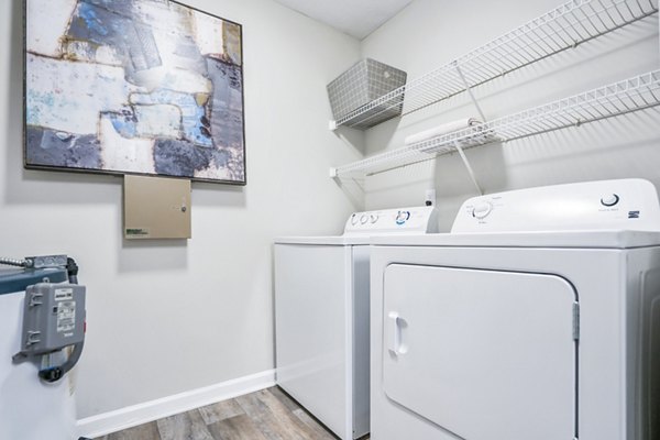 Laundry room with modern appliances at Bridgewater Apartments, featuring energy-efficient washers and dryers for convenient living
