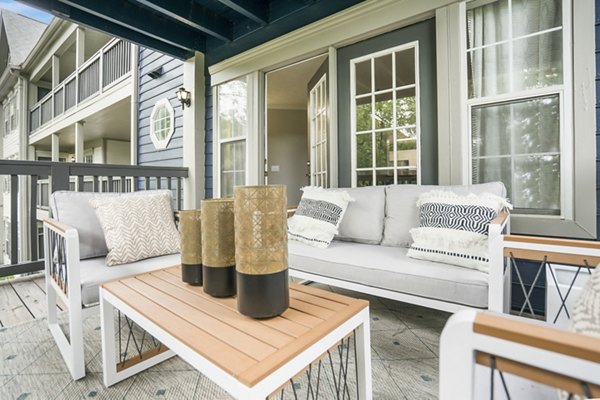 Spacious patio with cozy seating at Bridgewater Apartments, luxury living with serene outdoor retreat