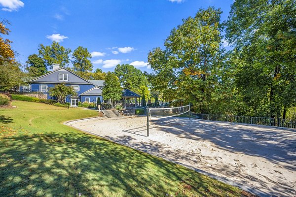 Outdoor volleyball court with net at Bridgewater Apartments offering luxury amenities Perfect for sports enthusiasts seeking an active lifestyle