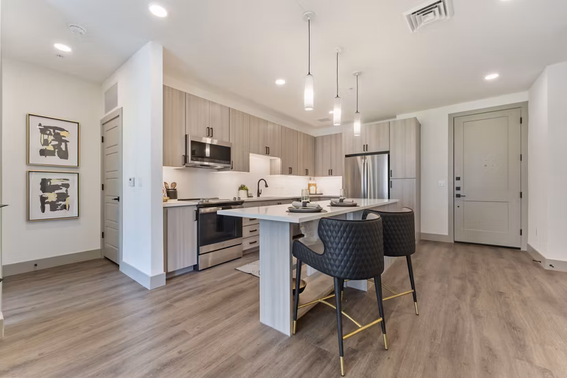 Modern kitchen with stainless steel appliances at Soltra at Kierland Apartments, Greystar luxury community in Scottsdale