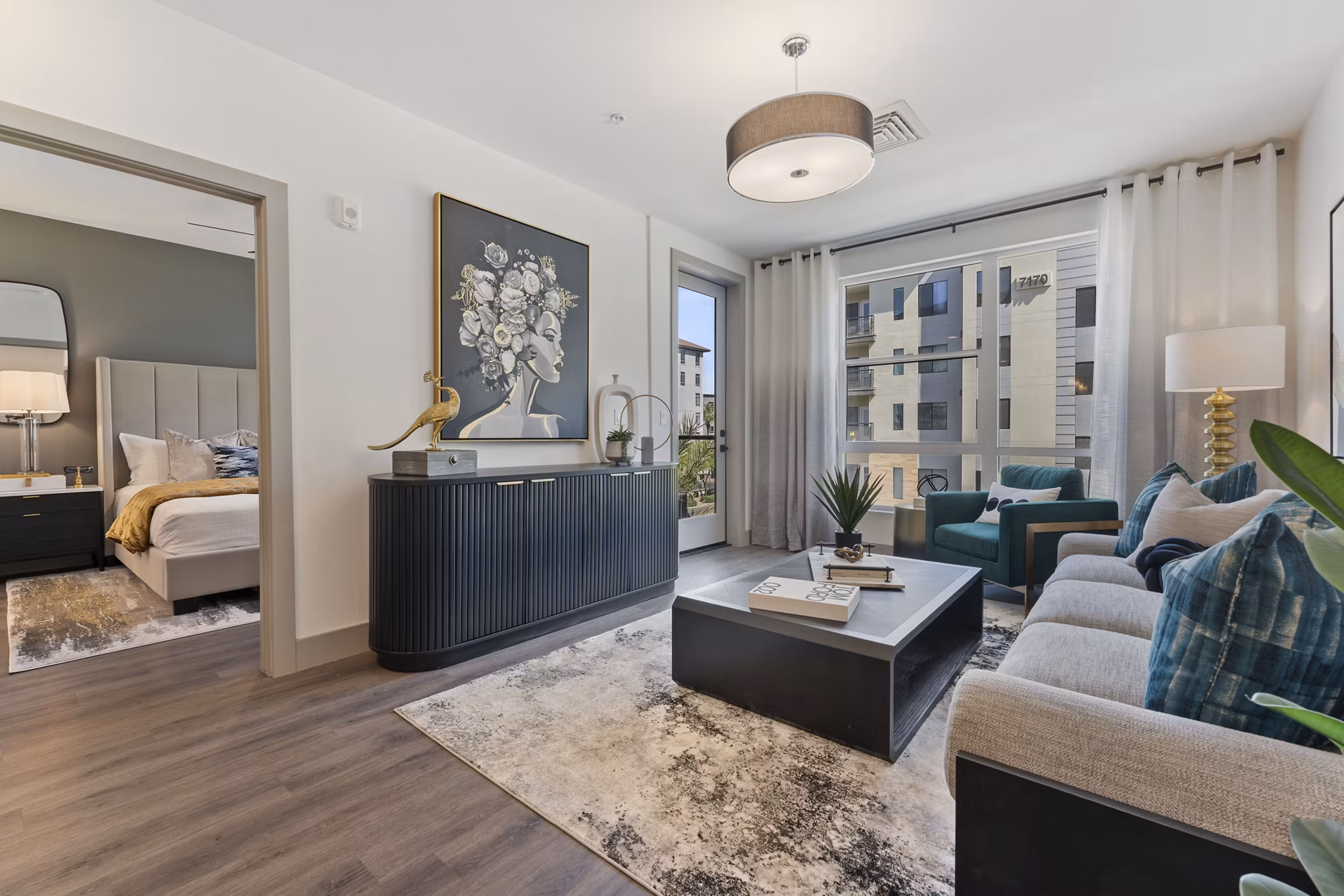 Spacious living room with modern decor and large windows at Soltra at Kierland luxury apartments