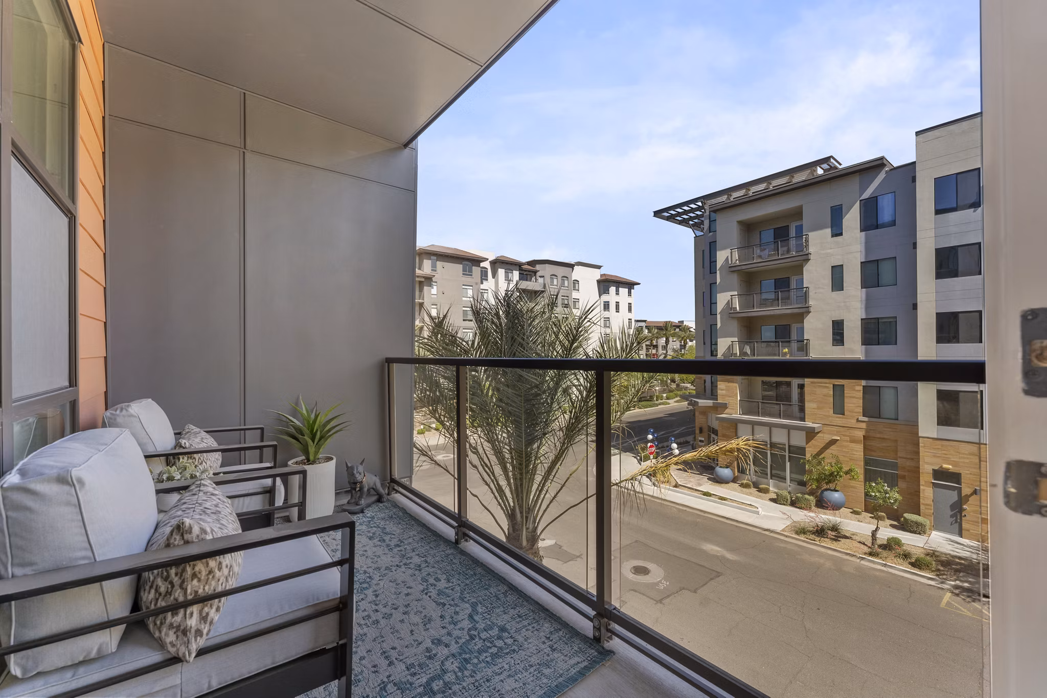 Contemporary patio with seating and greenery at Soltra at Kierland Apartments, ideal for relaxation and social gatherings