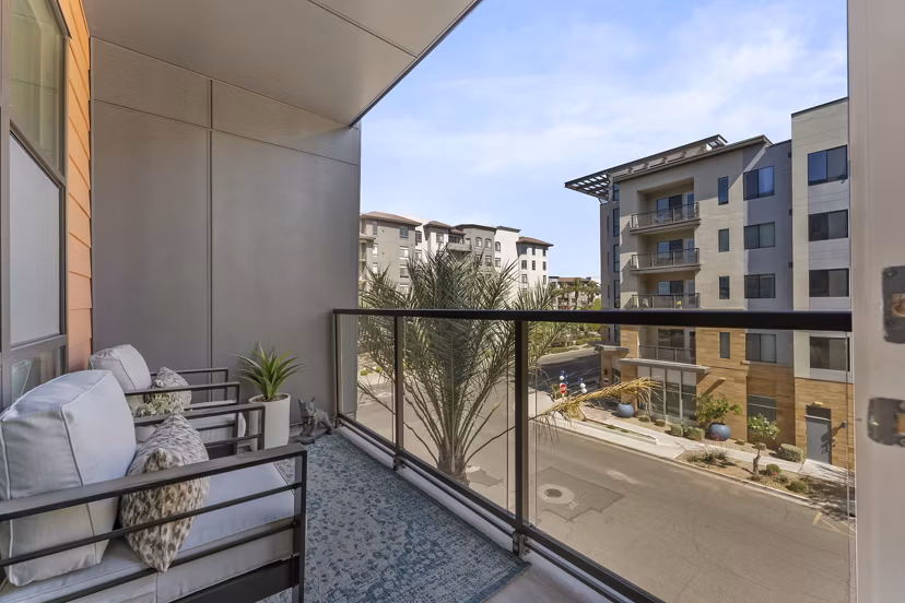 Contemporary patio with seating and greenery at Soltra at Kierland Apartments, ideal for relaxation and social gatherings
