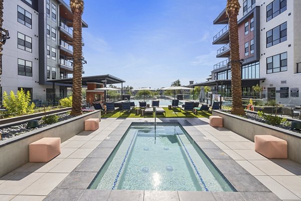 Contemporary outdoor pool at Soltra at Kierland Apartments, perfect for relaxation and leisure activities in a luxurious setting