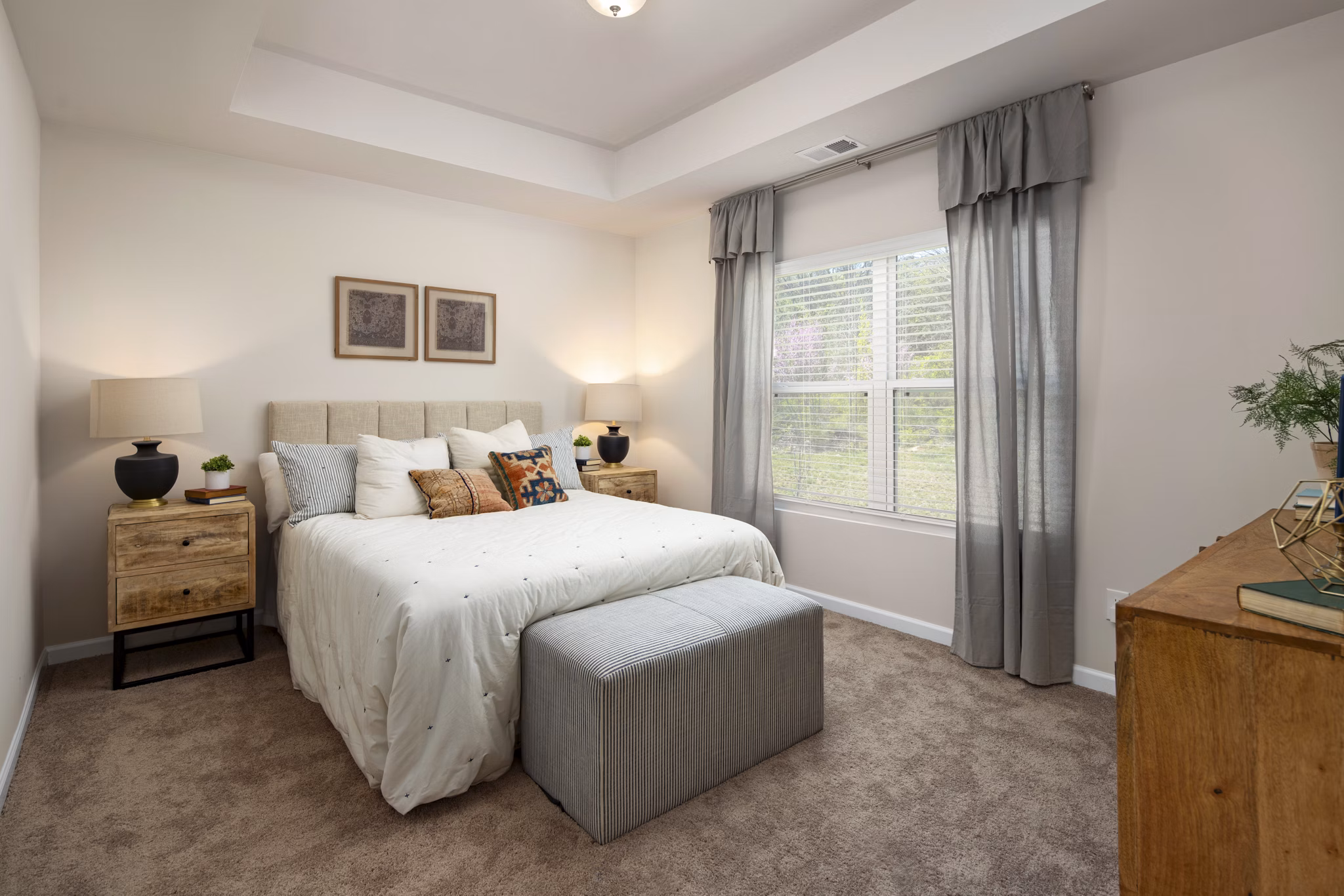 Spacious bedroom with modern decor at Townes at Hamilton Apartments, a Greystar luxury property