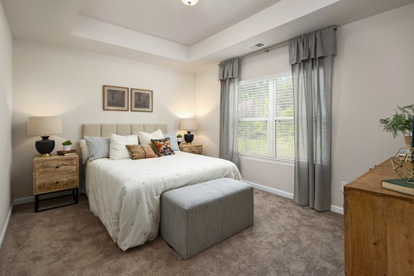 Spacious bedroom with modern decor at Townes at Hamilton Apartments, a Greystar luxury property