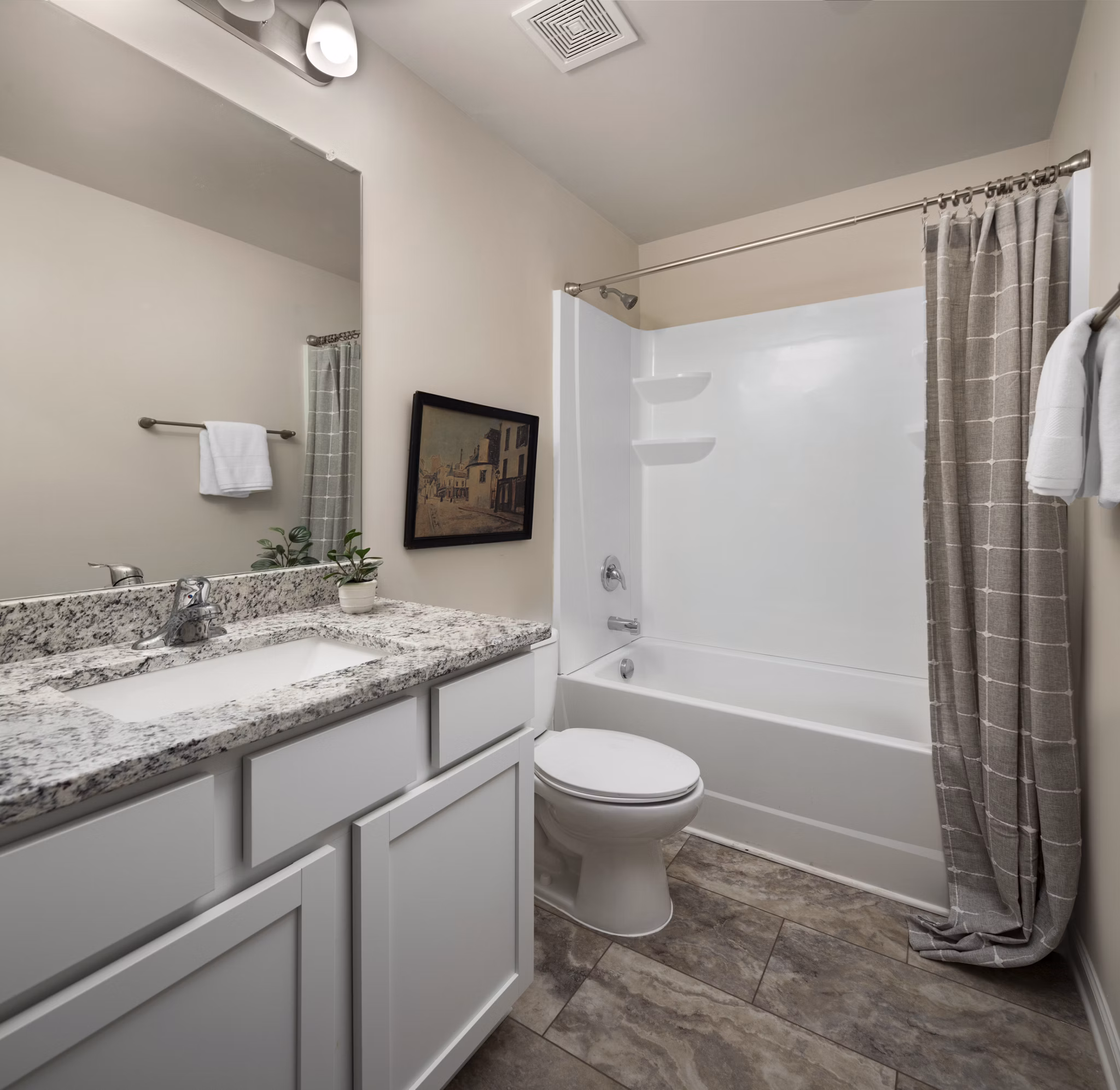 Modern bathroom with designer fixtures at Townes at Hamilton Apartments, offering luxury living with Greystar quality and comfort