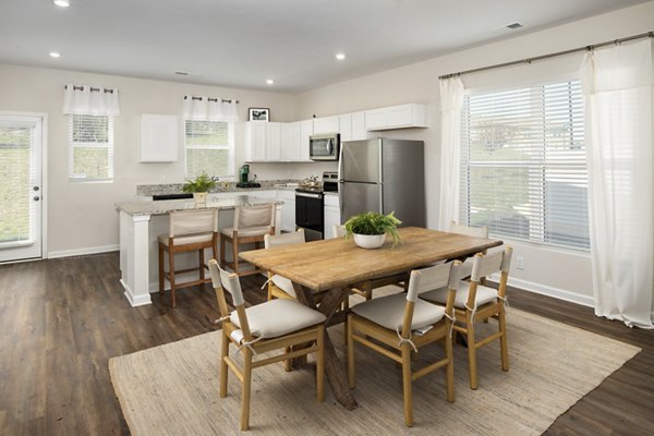 Modern dining area with sleek furniture at Townes at Hamilton Apartments
