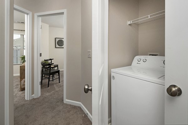 Elegant hallway with contemporary lighting at Townes at Hamilton Apartments, showcasing luxury living spaces