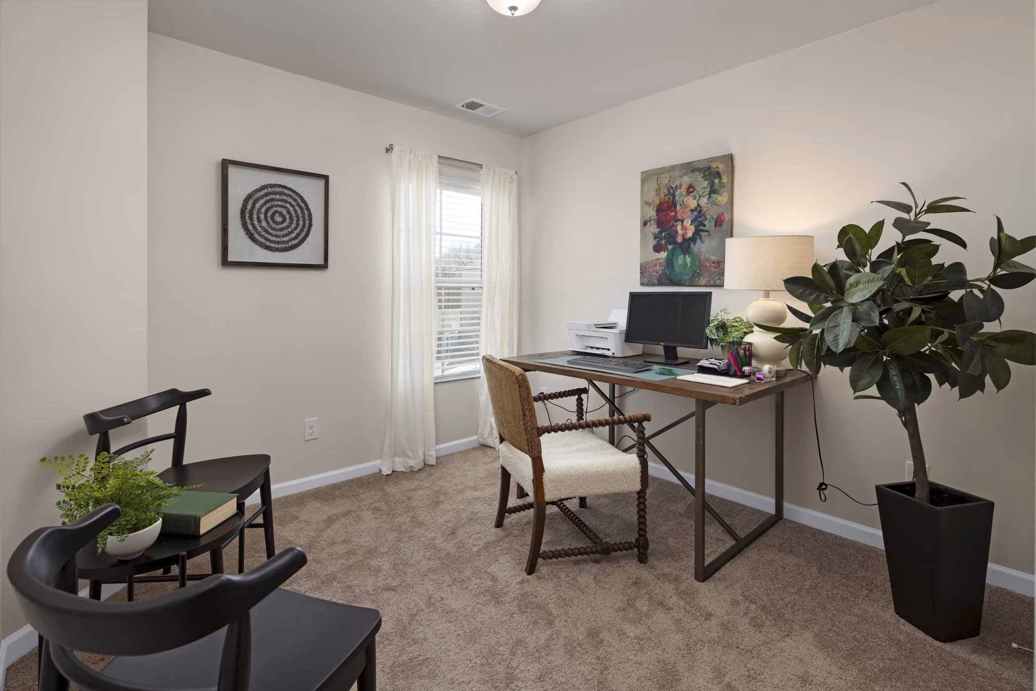 Modern home office with ergonomic desk and chair in Townes at Hamilton Apartments, offering a productive work-from-home environment