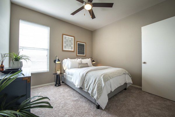 Cozy bedroom featuring modern design at Olympus Team Ranch Apartments