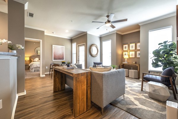 Modern kitchen with stainless steel appliances in Olympus Team Ranch Apartments, a Greystar property