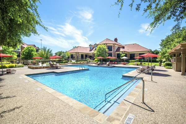 Luxury pool at Olympus Team Ranch Apartments offering relaxation and leisure amenities