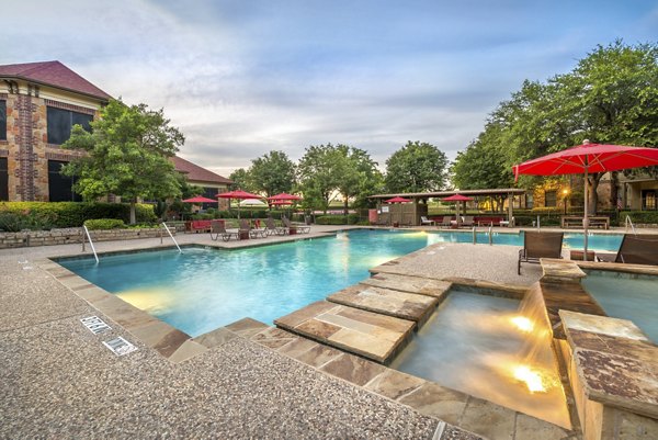 Resort-style pool at Olympus Team Ranch Apartments offers luxury relaxation