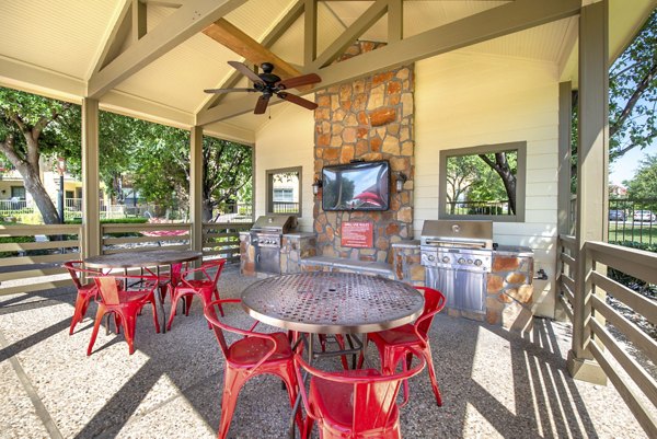 Spacious grill area with modern amenities at Olympus Team Ranch Apartments in luxury setting