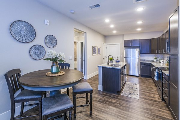 Dining room featuring elegant furnishings and natural light at Retreat at Patriot Park Apartments