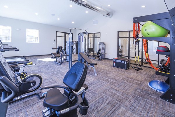 State-of-the-art fitness center with modern exercise equipment at Retreat at Patriot Park Apartments