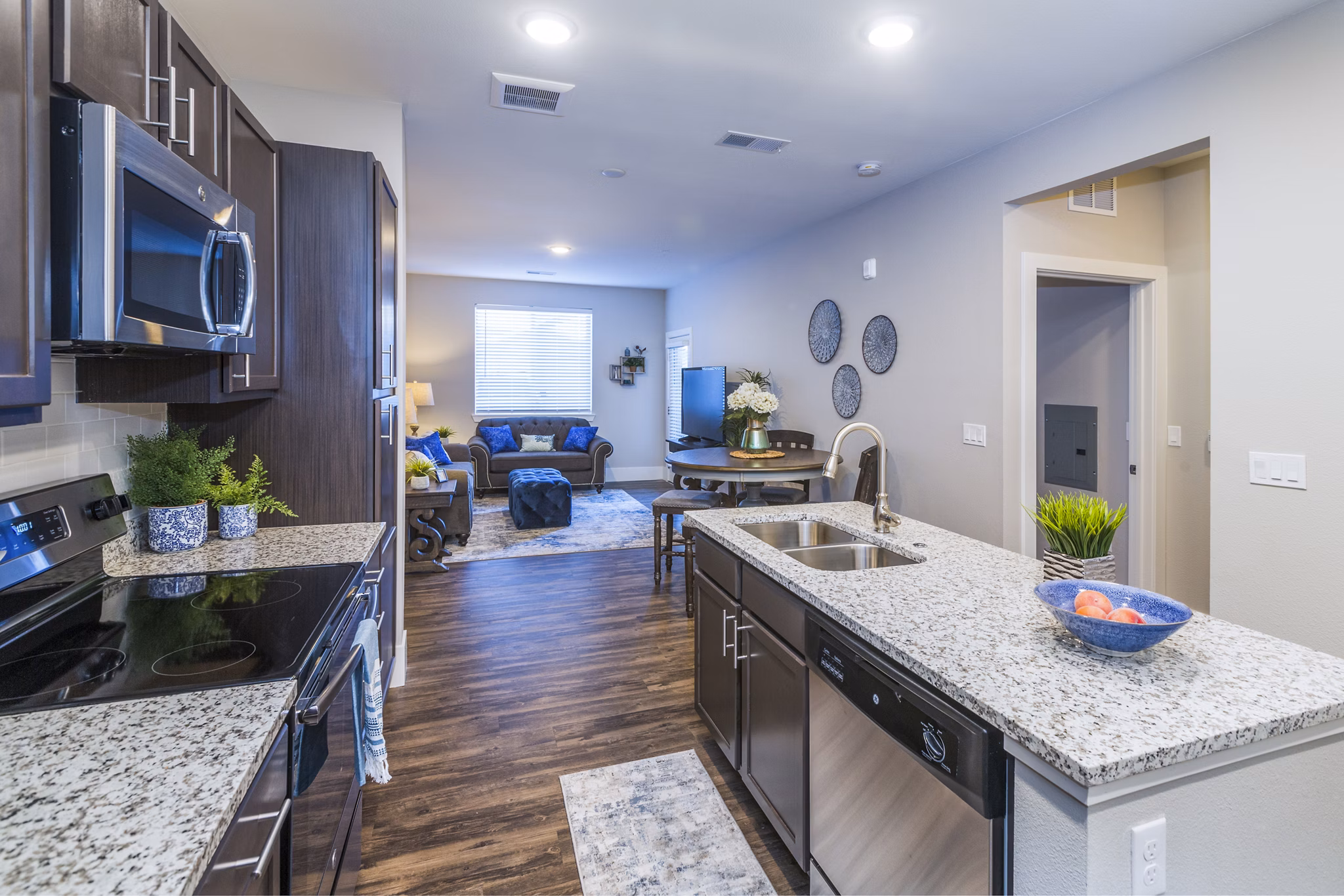 Modern kitchen with stainless steel appliances at Retreat at Patriot Park Apartments