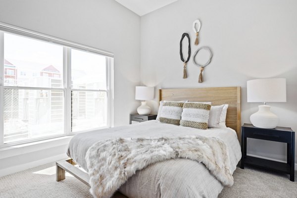 Cozy bedroom with modern decor in Millyard at Meadow Commons Apartments