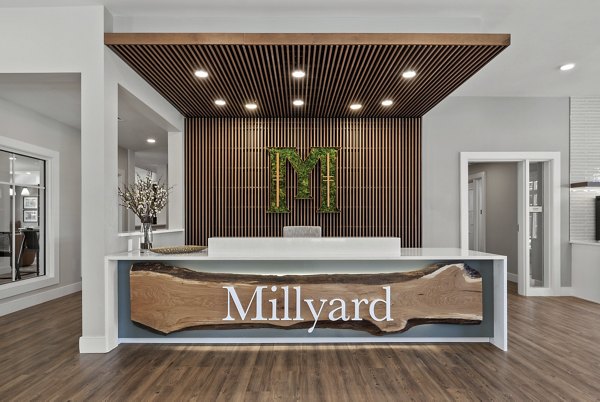 Clubhouse featuring modern seating and decor at Millyard at Meadow Commons Apartments