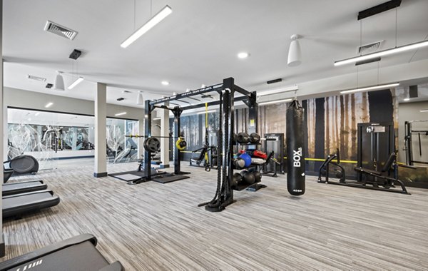 State-of-the-art fitness center with modern gym equipment at Millyard at Meadow Commons Apartments