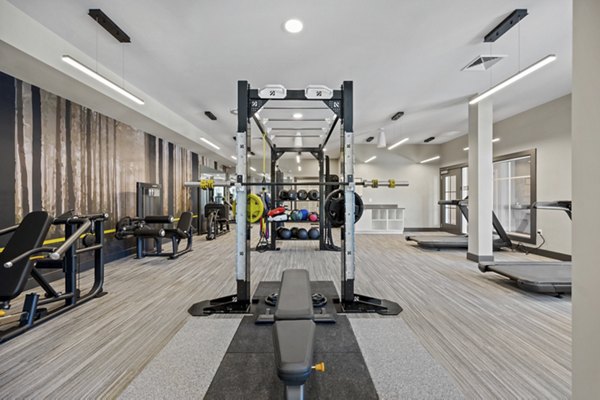 State-of-the-art fitness center with modern equipment at Millyard at Meadow Commons Apartments