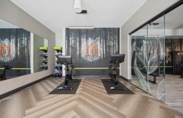 Fully-equipped fitness center at Millyard at Meadow Commons Apartments