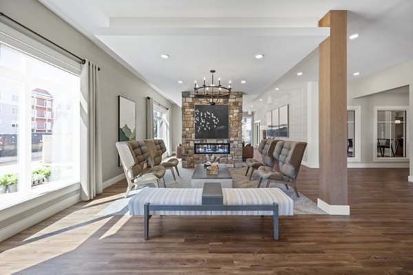 Spacious living room with modern decor at Millyard at Meadow Commons Apartments