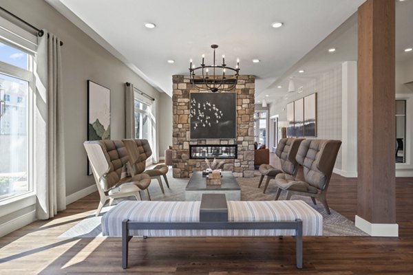 Spacious living room with modern furnishings at Millyard at Meadow Commons Apartments