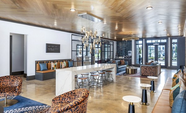 Clubhouse lobby featuring modern seating and decor at The Premier Apartments
