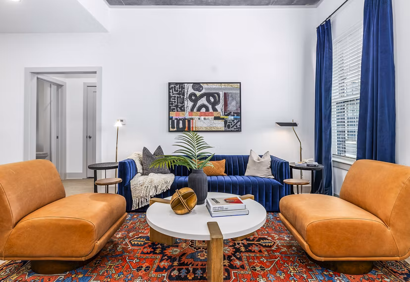 Living room with modern furniture and open layout at The Premier Apartments, ideal for luxury urban living