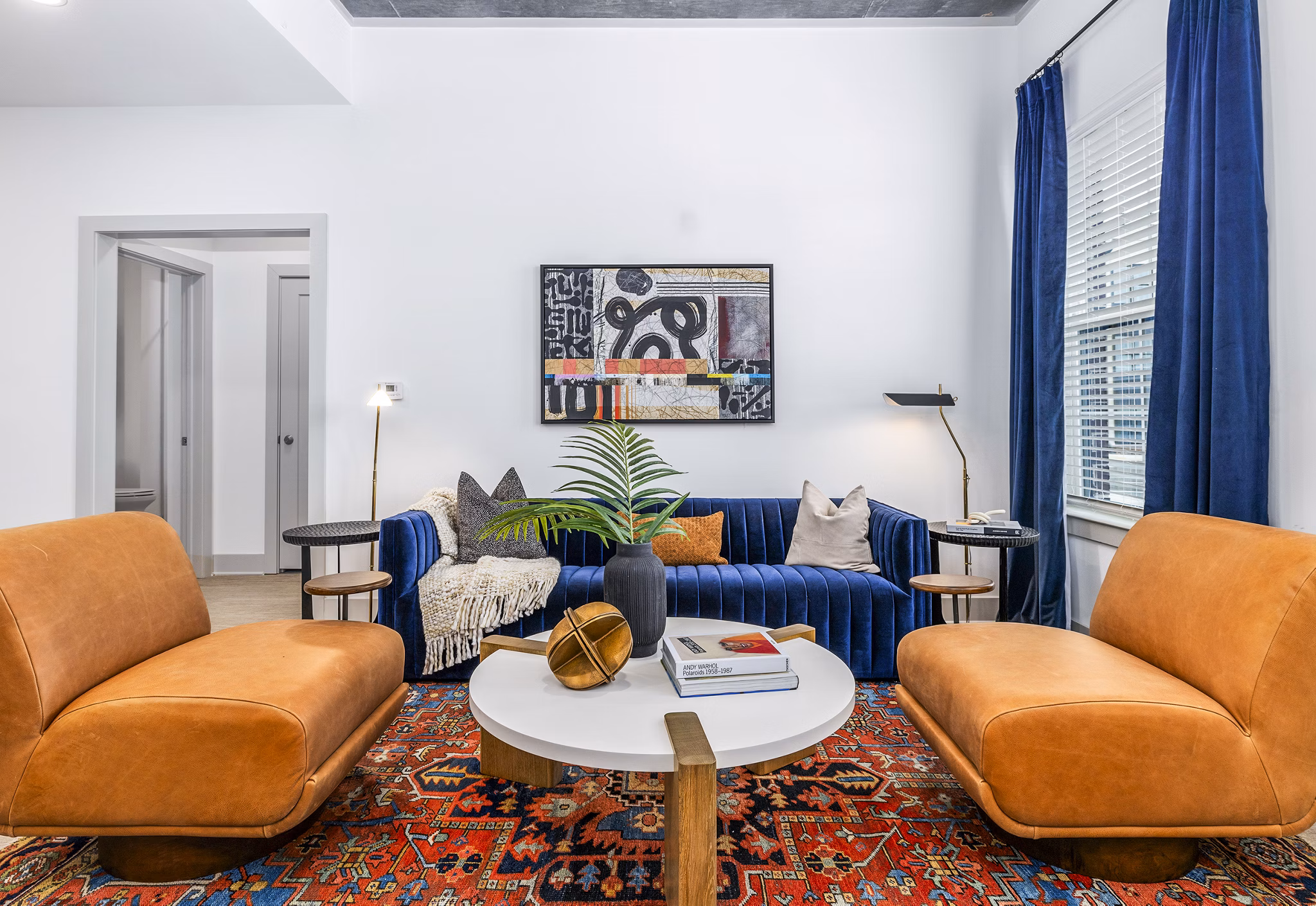 Living room with modern furniture and open layout at The Premier Apartments, ideal for luxury urban living