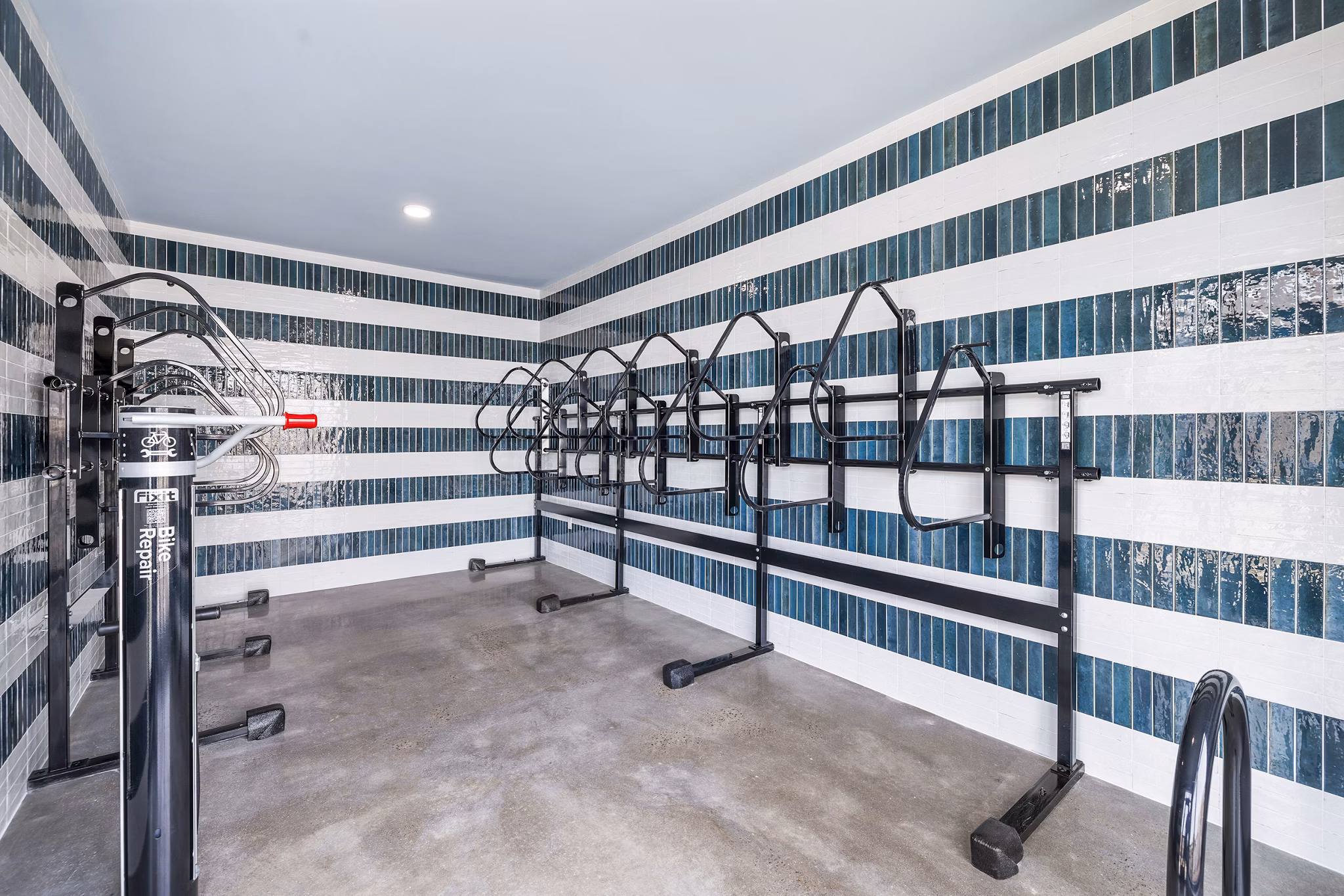 Bicycle storage facility at The Premier Apartments featuring secure racks and ample space for residents' convenience
