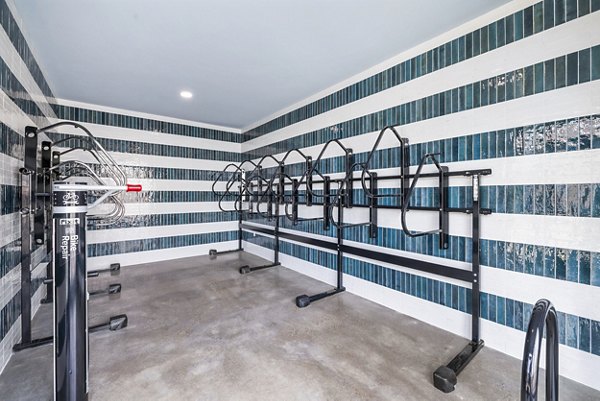 Bicycle storage facility at The Premier Apartments featuring secure racks and ample space for residents' convenience
