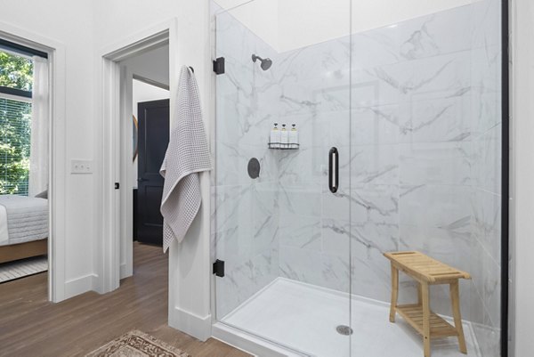 Bathroom featuring modern fixtures at Mira Raleigh Apartments