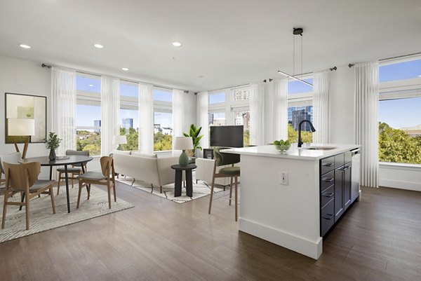 Clubhouse featuring modern design and communal seating at Mira Raleigh Apartments