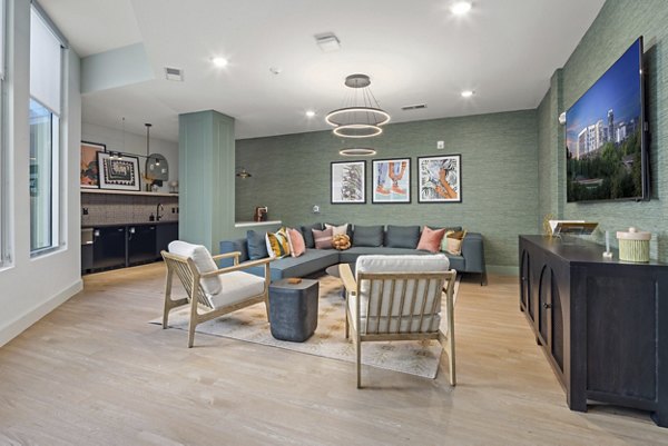 Clubhouse featuring modern design and cozy seating at Mira Raleigh Apartments